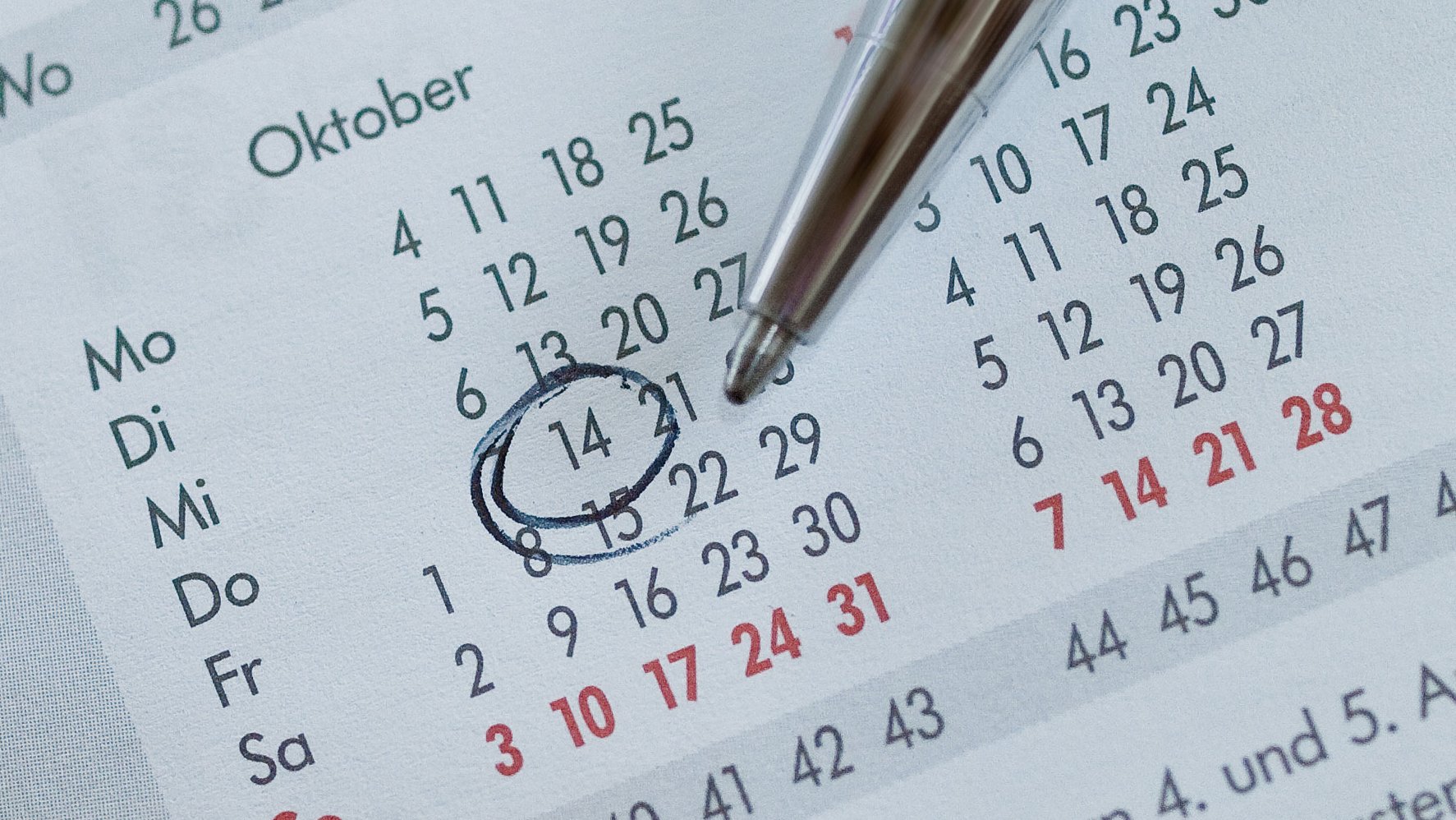 A pencil on a calendar. 