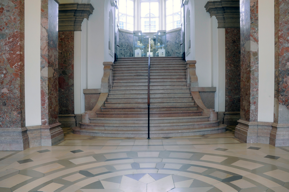 a classical stairwell with marble stairs